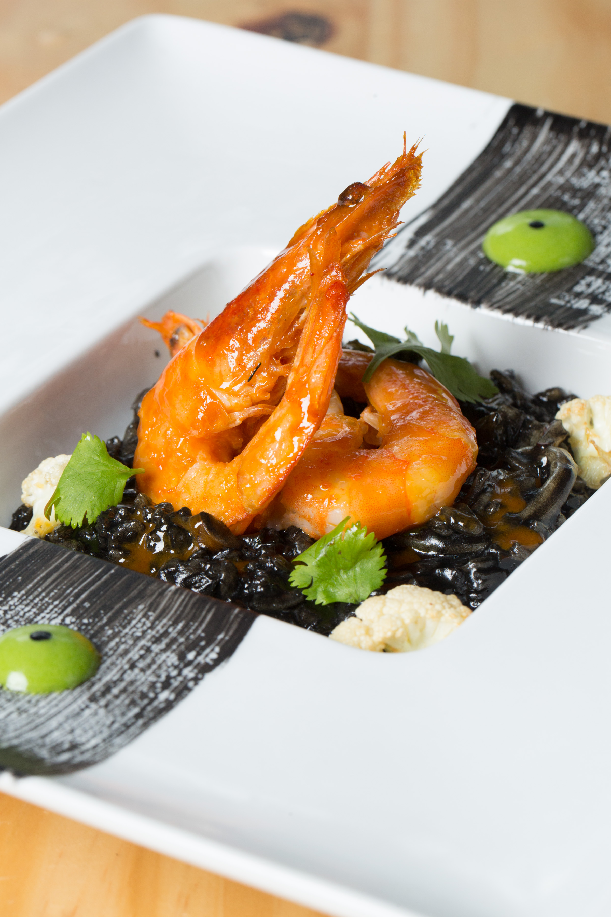 Langoustines with squid ink risotto